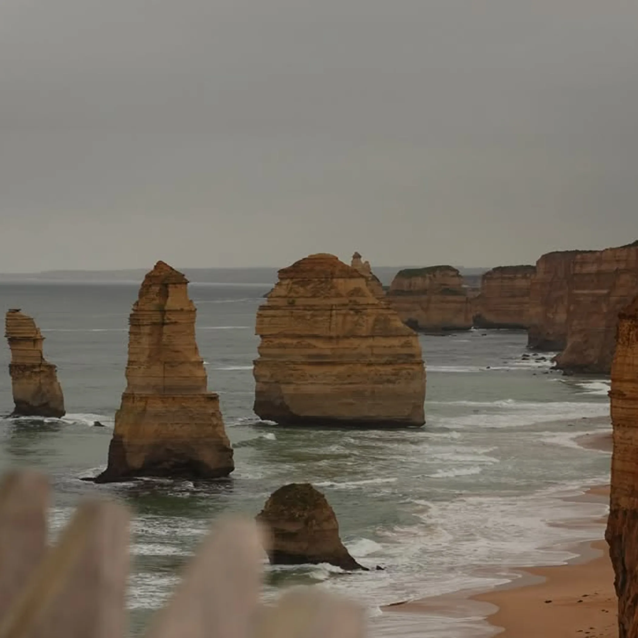 stormy skies over great ocean road cliffs